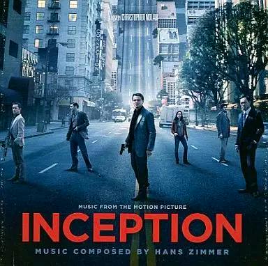 Cover art for the Inception soundtrack CD showing characters standing on a city street with the large title "INCEPTION".