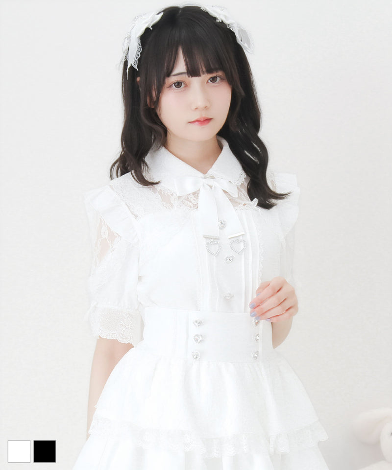 A model wearing a white lace frill heart bijou women's blouse shown from the waist up.