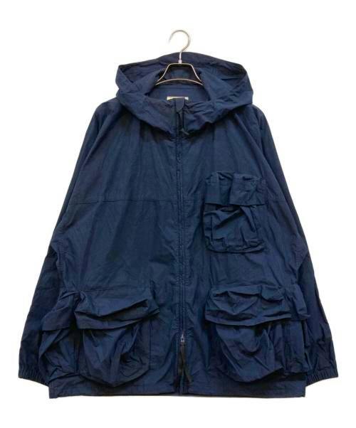 Indigo hooded men's cotton parka with multiple front flap pockets displayed on a hanger against a white background.