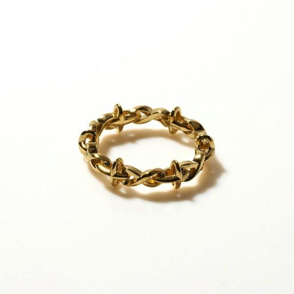 A close-up photo of the Infinity Cross Ring YG showing a linked-band ring on a plain white background.