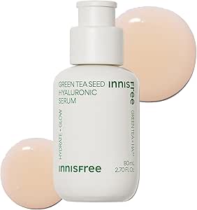 White pump bottle labeled Innisfree Green Tea Seed Hyaluronic Serum with two beige serum swatches behind it.