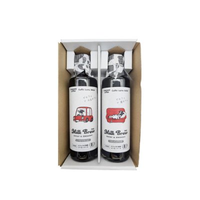 Two bottles of the product (イノセントコーヒー デカフェ) packed upright in a cardboard box with their labels visible.