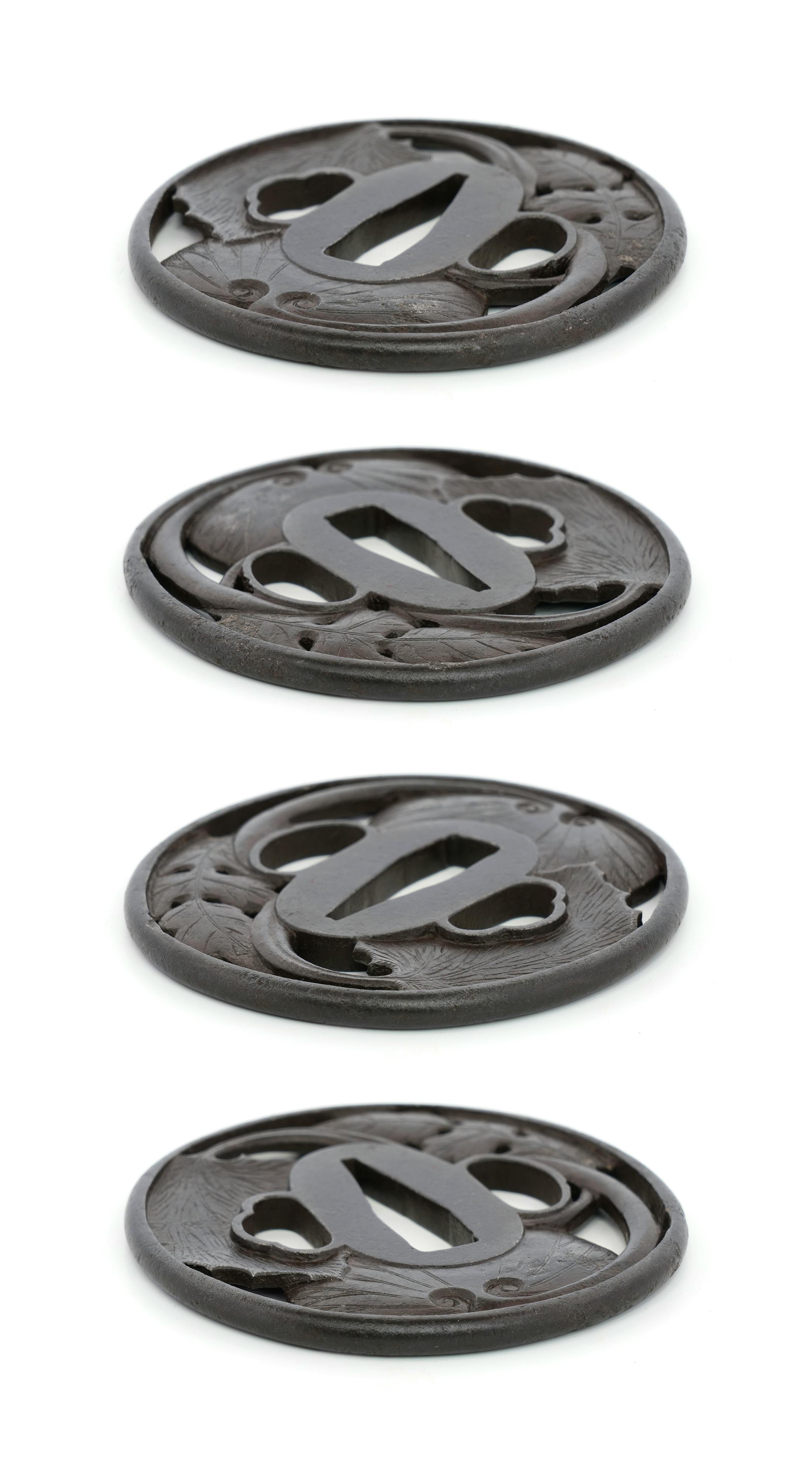 Multiple close-up views of an iron tsuba (Japanese sword guard) shown on a white background.