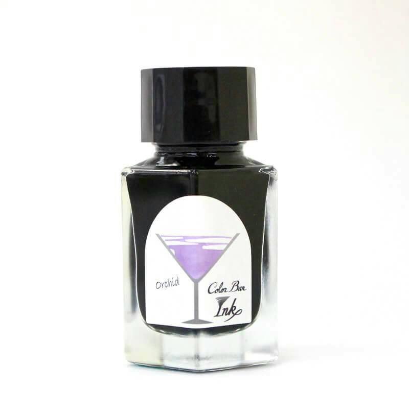 Front view of the fountain pen ink bottle (No.89 “Orchid”) showing the label with a purple cocktail-glass illustration.