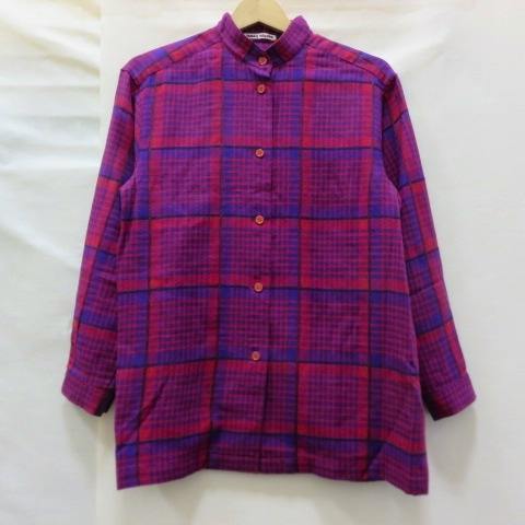 Front view of a red and purple checkered stand-collar men's shirt hanging on a hanger.