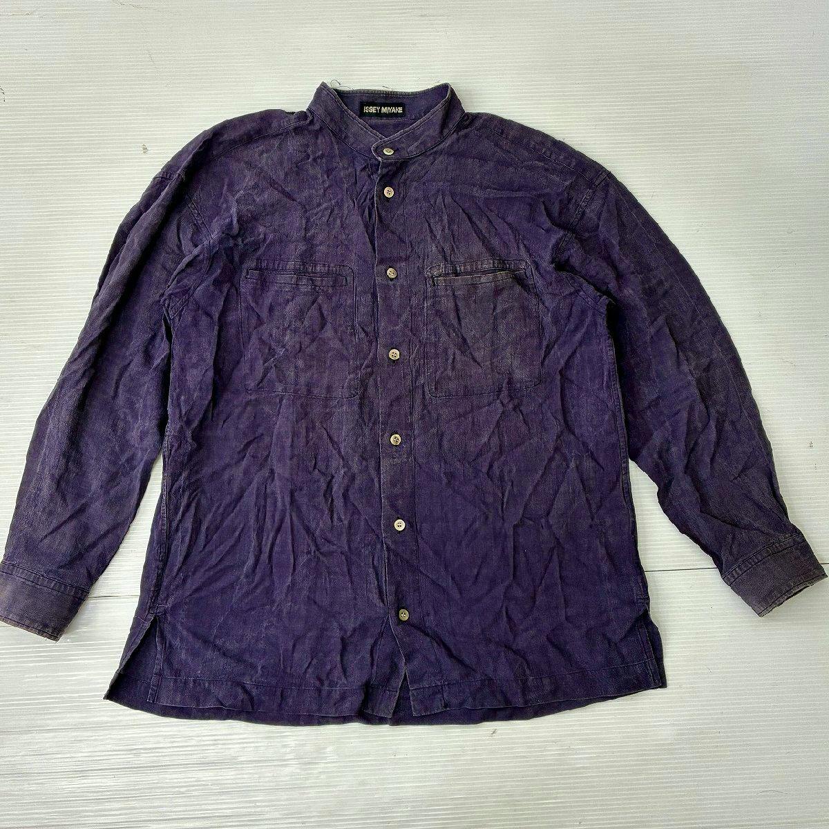 Purple men's long-sleeve band-collar shirt laid flat showing front buttons and two chest pockets.