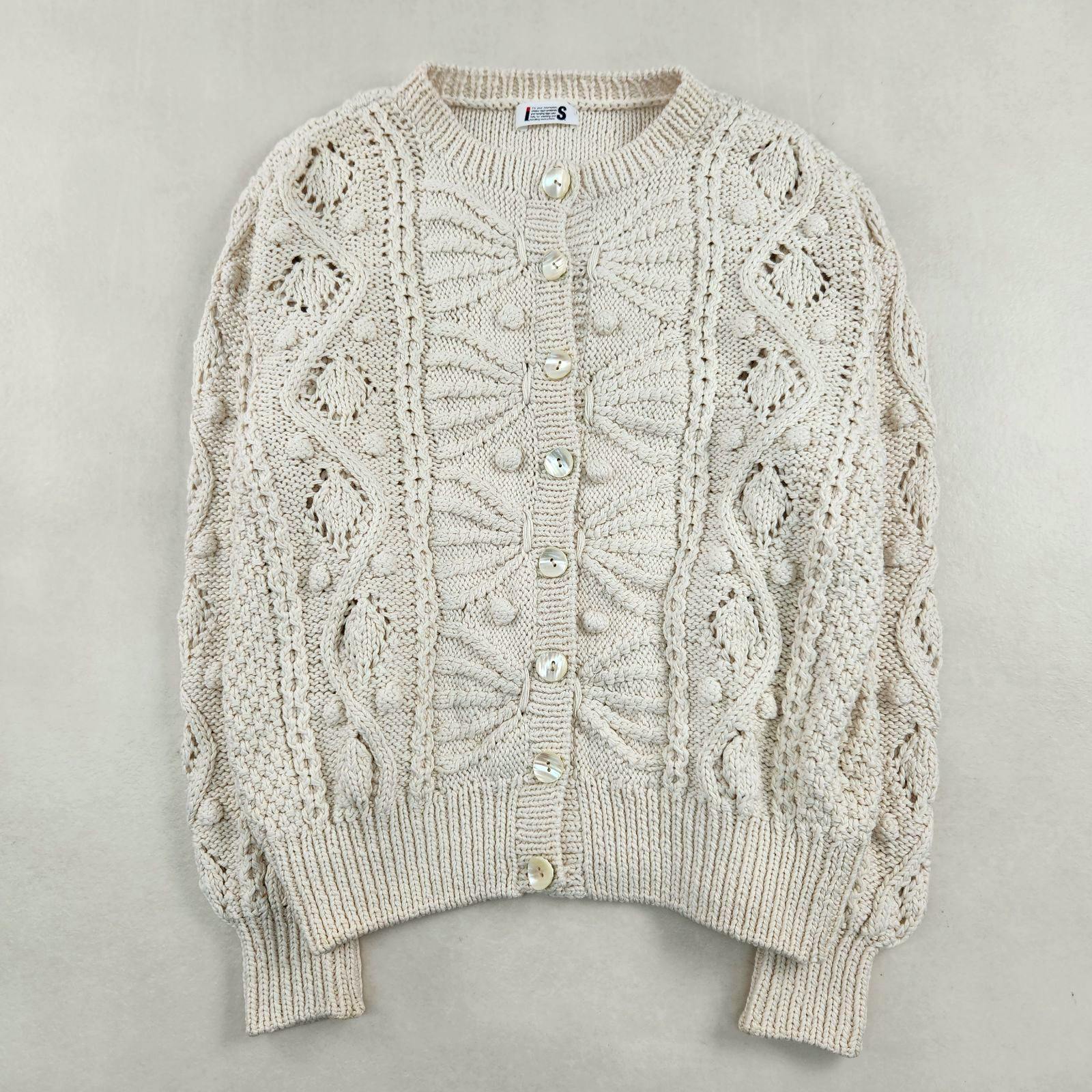 Off-white Issey Miyake cardigan in cotton with a 3D knit pattern and front buttons.
