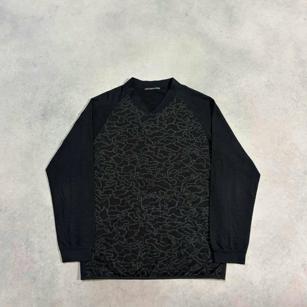 Front view of an ISSEY MIYAKE MEN camo mesh long-sleeve shirt laid flat on a light background.