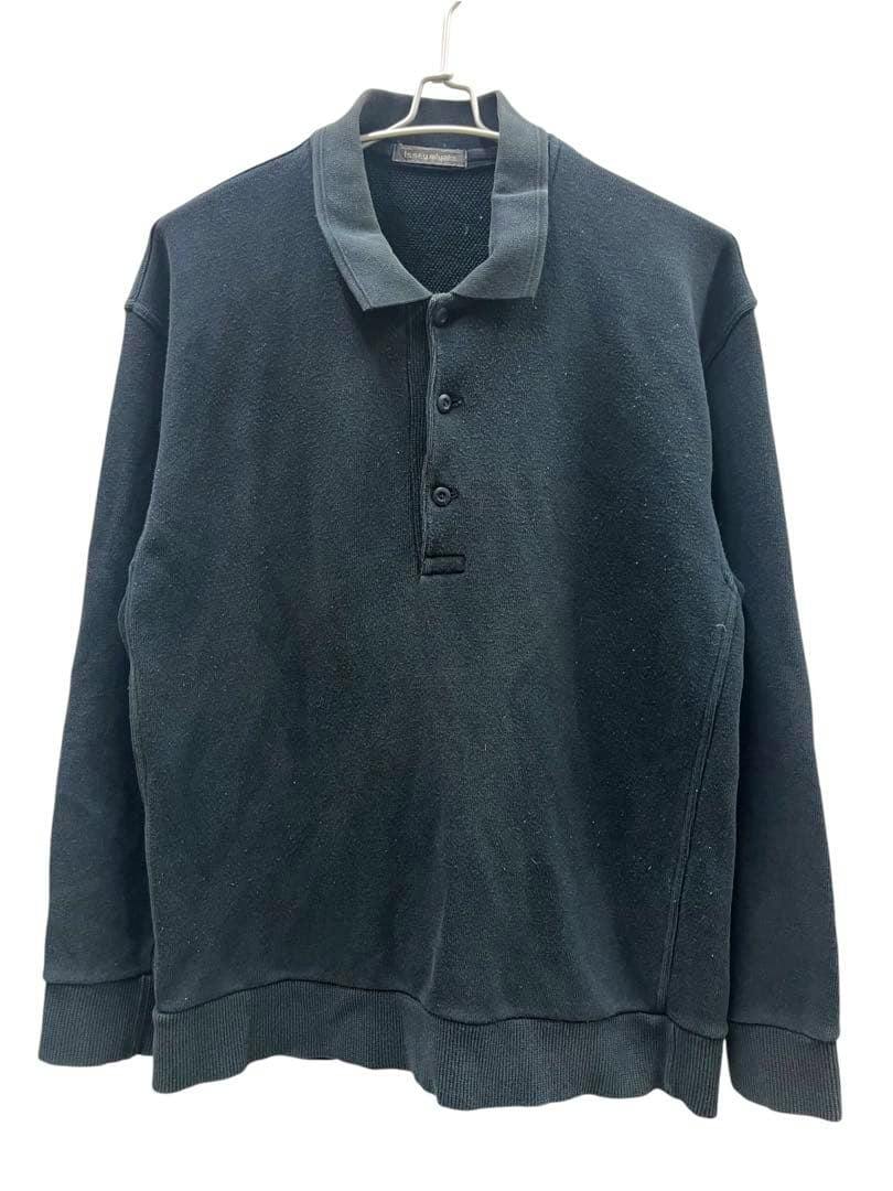 Front view of a men's black ISSEY MIYAKE sweatshirt polo hanging on a hanger.