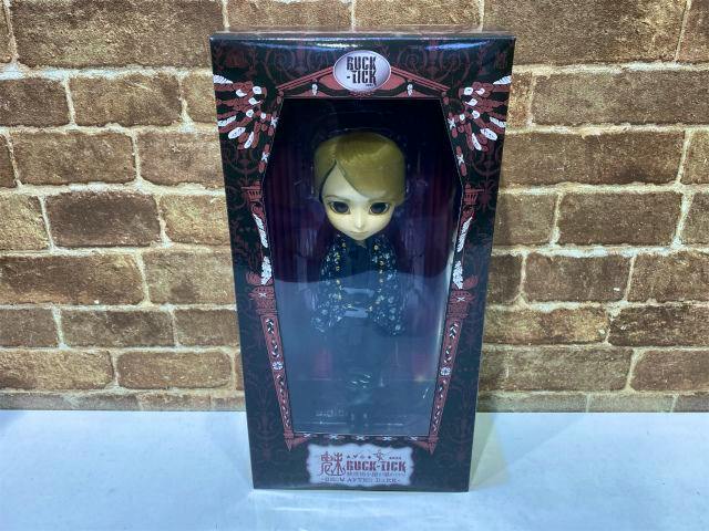 Boxed BUCK-TICK Higuchi Yutaka collaboration I-953 doll visible through windowed packaging.