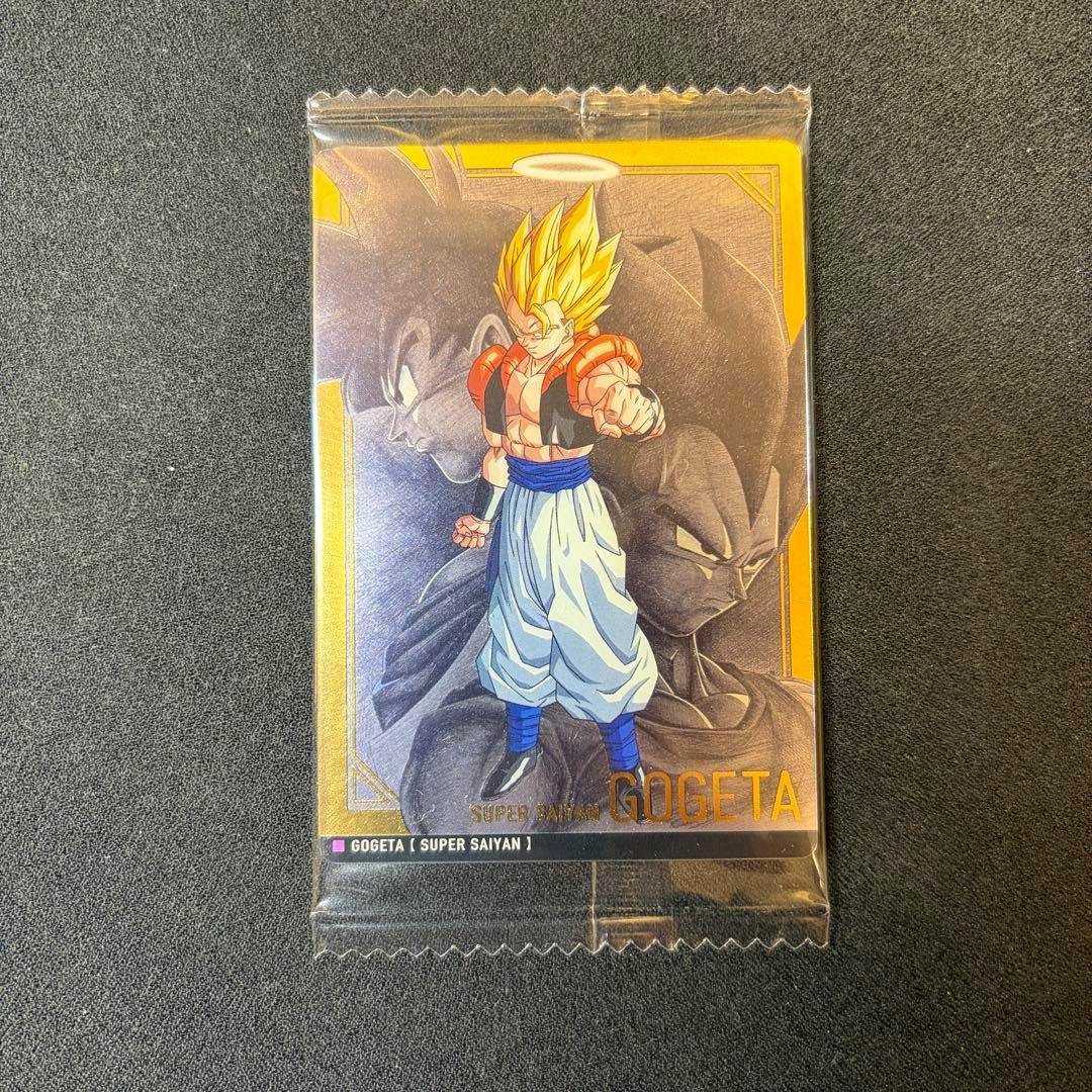 Photocard showing Super Saiyan Gogeta front artwork in a clear plastic sleeve on a black background.