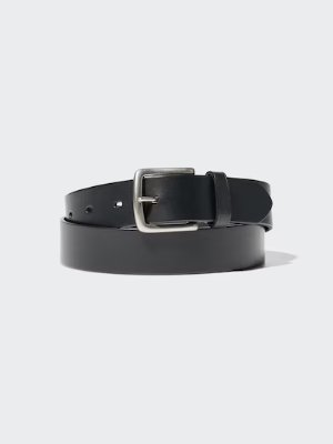 Coiled black cow leather belt with a silver buckle on a light background.
