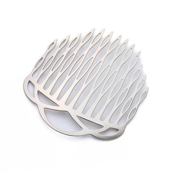 Silver-colored hair comb laid flat on a white background, showing multiple elongated teeth and decorative cutouts.