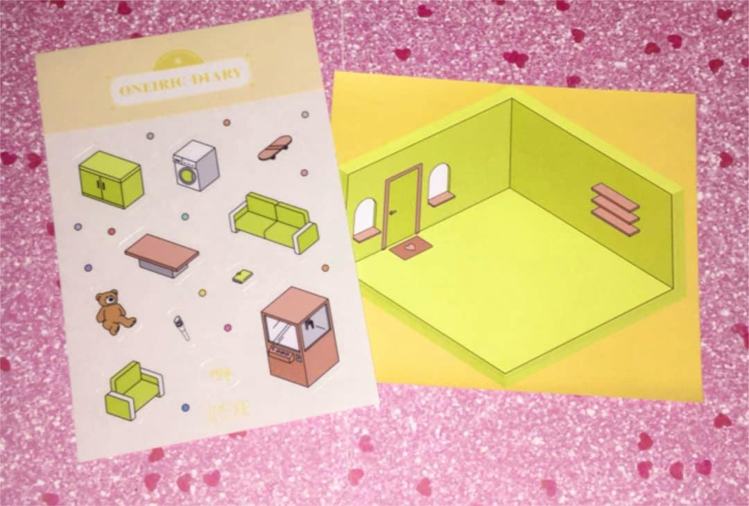 Two paper sticker sheets for a room sticker set: one sheet with small furniture stickers and one with a yellow-green isometric room background on a pink patterned surface.