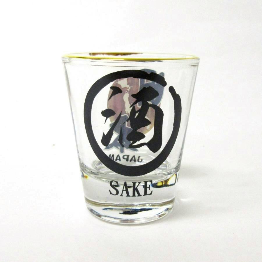 Clear glass shot glass with a black Japanese kanji design inside a circle and the word "SAKE" printed below.