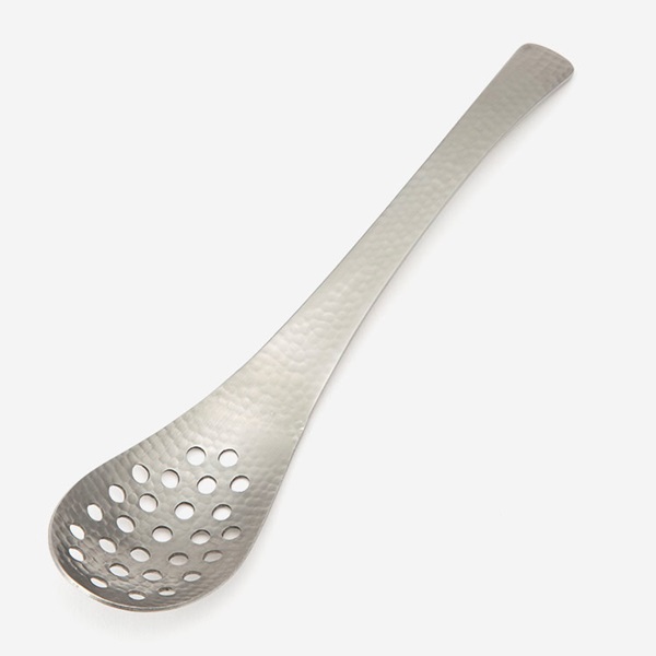 A stainless steel perforated spoon with a hammered finish on a white background.