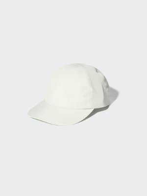White Jean-Michel Basquiat UV-cut polyester cap photographed on a light background.