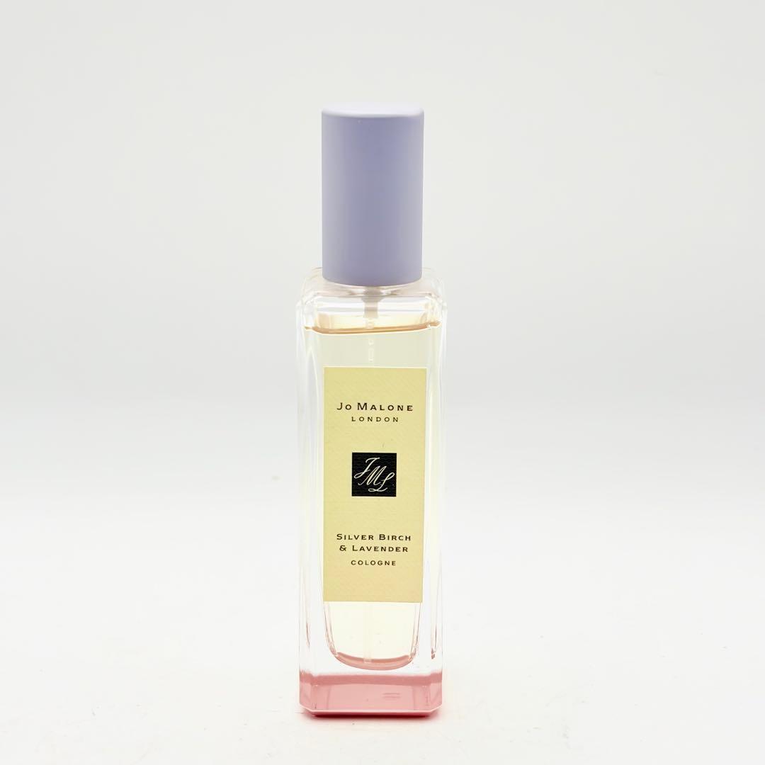 Front view of a Jo Malone Silver Birch & Lavender cologne 30ml glass bottle with a purple cap and pink base.
