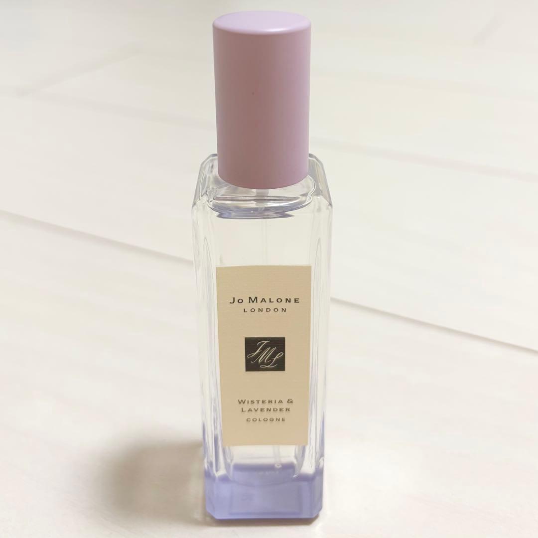 Front view of the Jo Malone Wisteria & Lavender cologne glass bottle with a pale pink cap and visible label.
