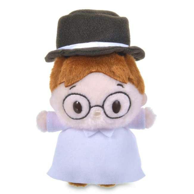 Plush toy of John from Peter Pan wearing a hat and round glasses on a white background.
