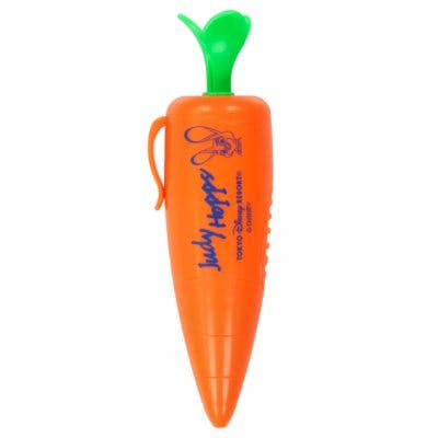 Orange carrot-shaped ballpoint pen with a green leaf top and a side clip.