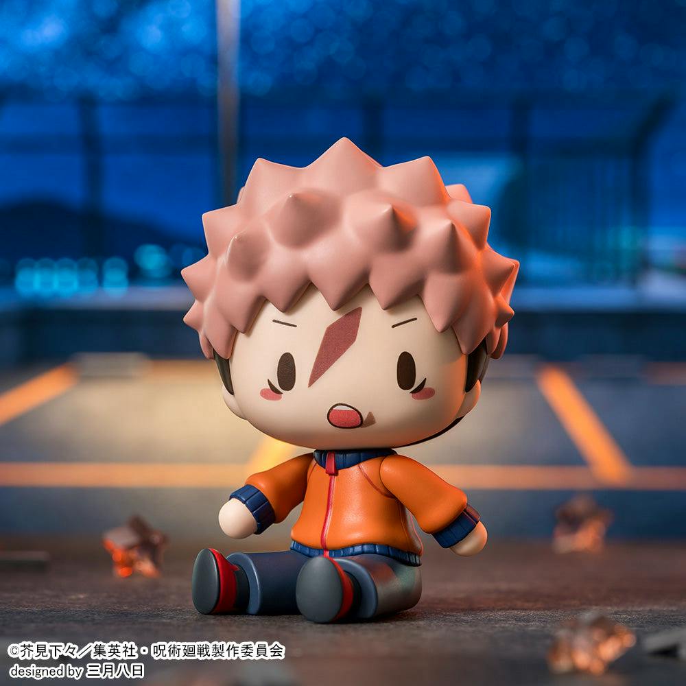 Chibi deformed figure of Itadori Yuji from Jujutsu Kaisen sitting and wearing an orange jacket.