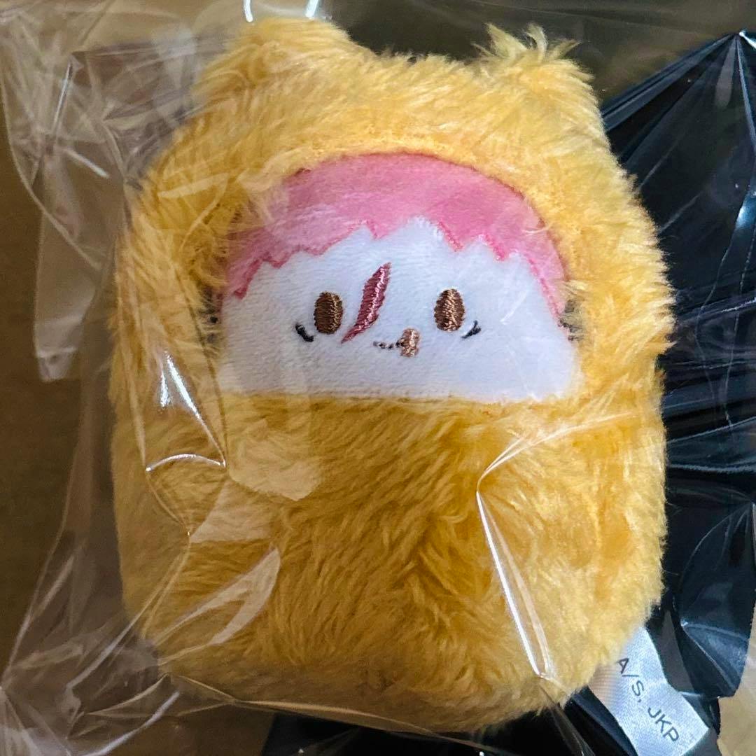 A yellow furry plush of Itadori Yuji from Jujutsu Kaisen inside clear plastic packaging.