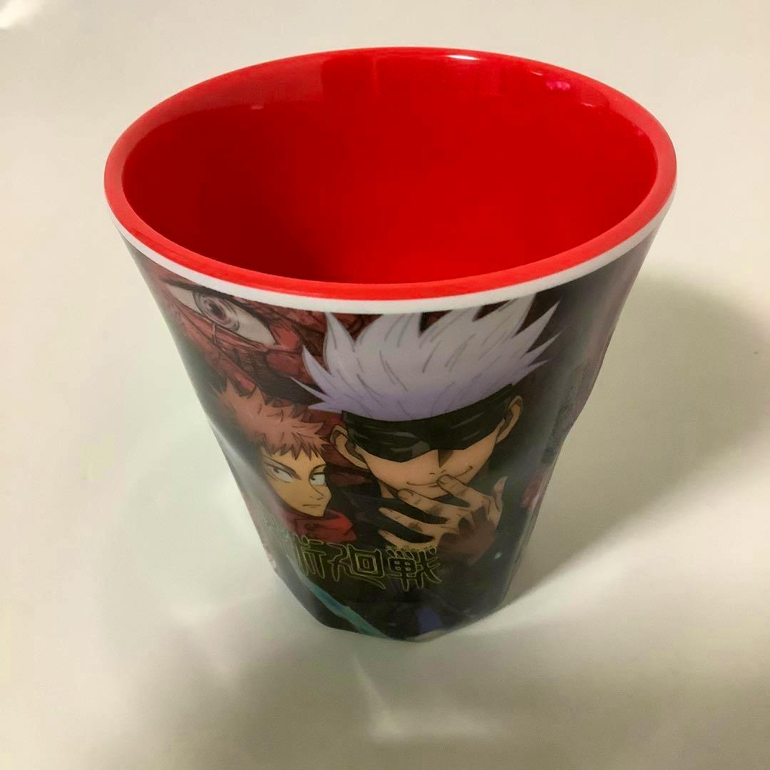 Top-down view of a melamine/plastic Jujutsu Kaisen cup showing a red interior and character artwork on the exterior.