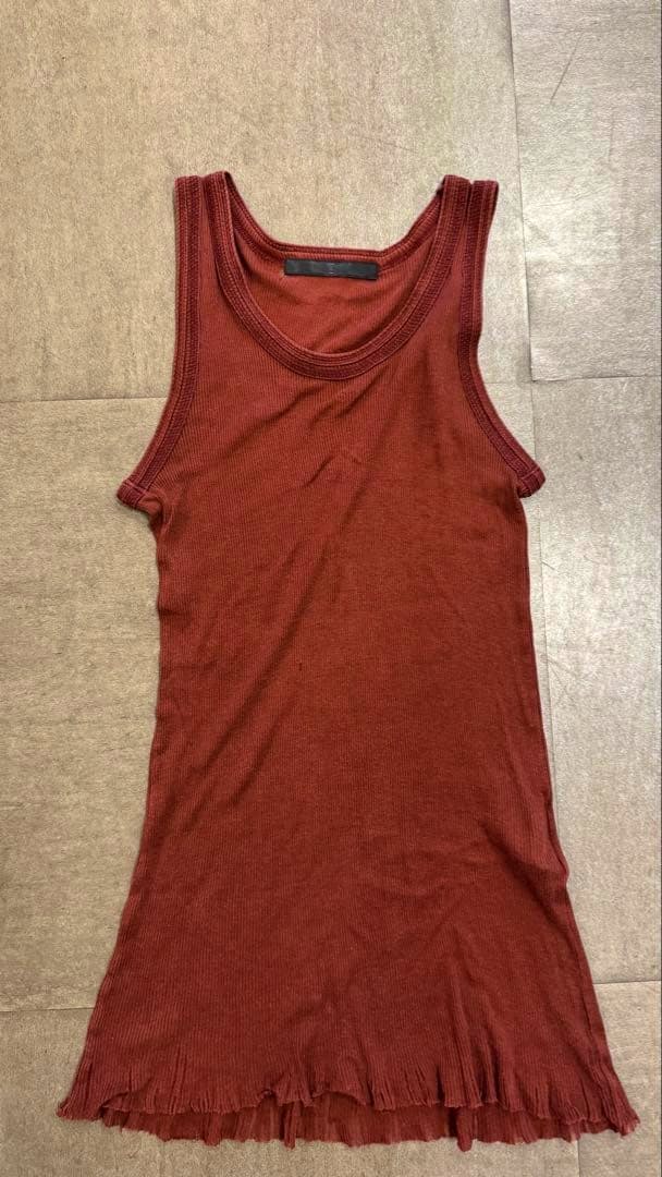 Burgundy ribbed cotton tank top (singlet) laid flat showing the front.