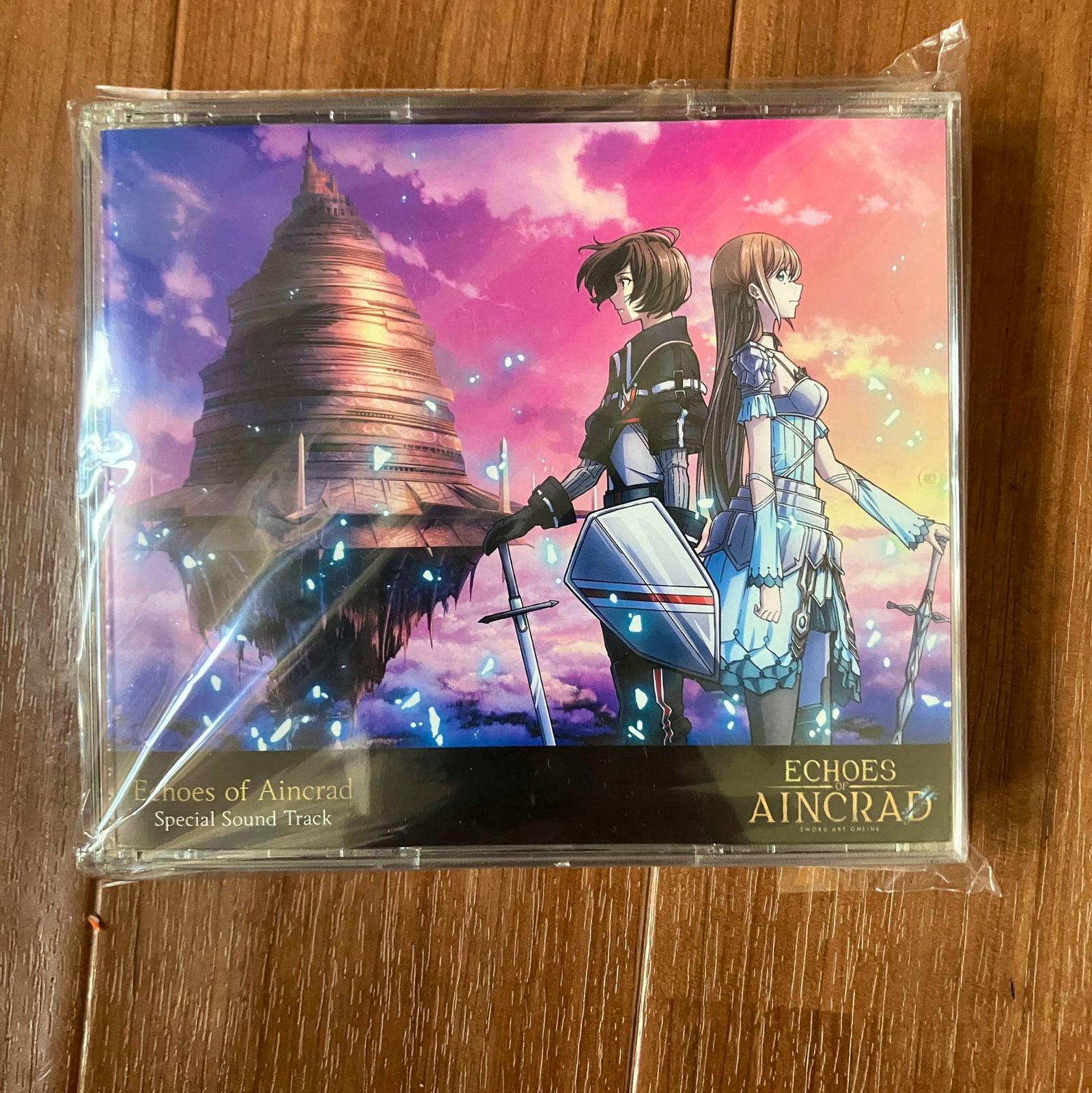 Front cover of the Echoes of Aincrad soundtrack CD showing two characters standing back-to-back with the Aincrad castle artwork in the background.