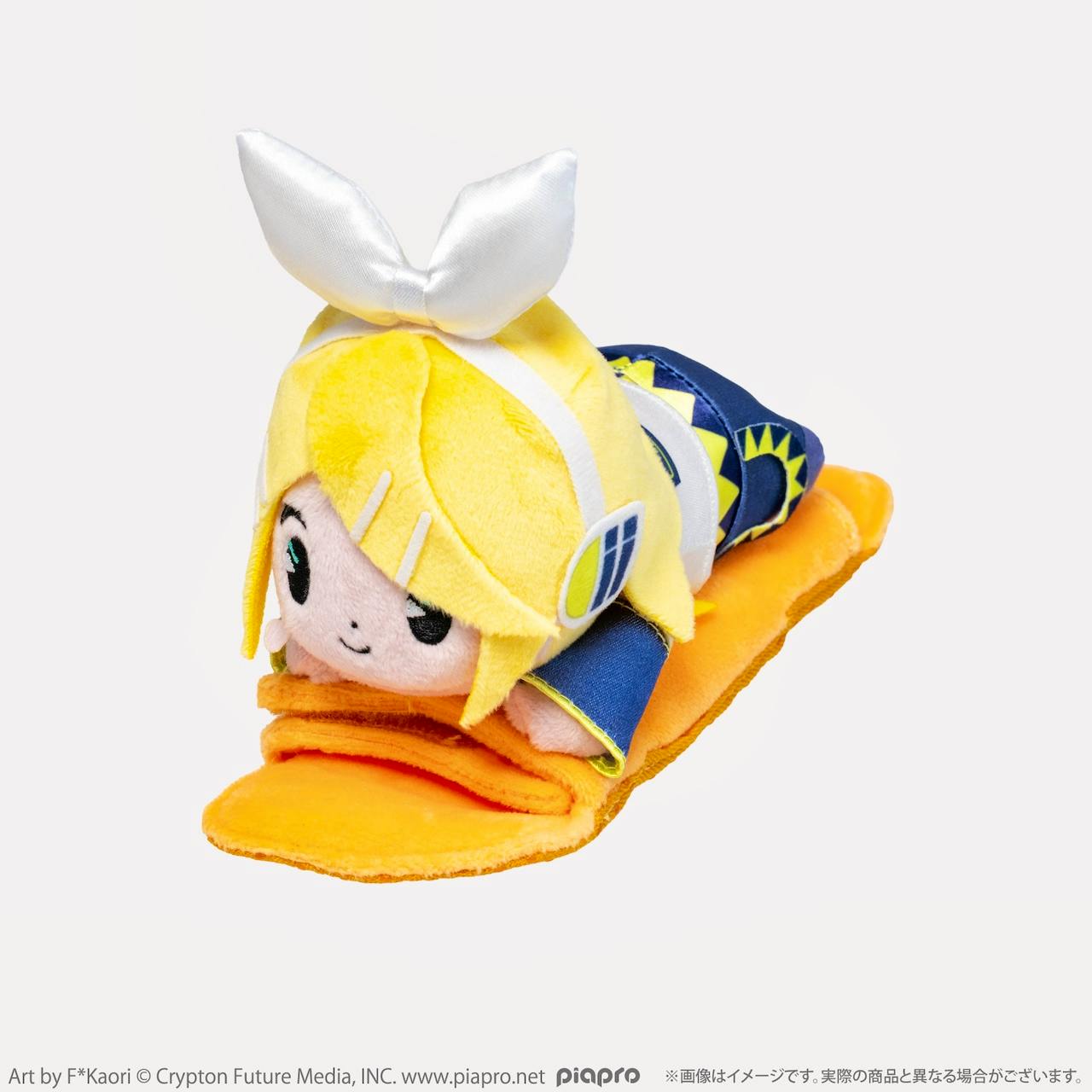 A Kagamine Rin shoulder-riding plush toy lying on an orange shoulder pad against a white background.