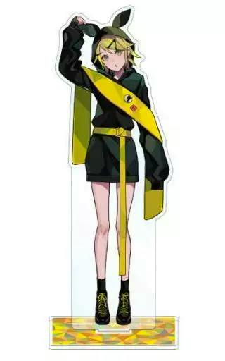 Acrylic stand showing a full-body illustration of Kagamine Rin in a black and yellow street-style outfit on a clear rectangular base.