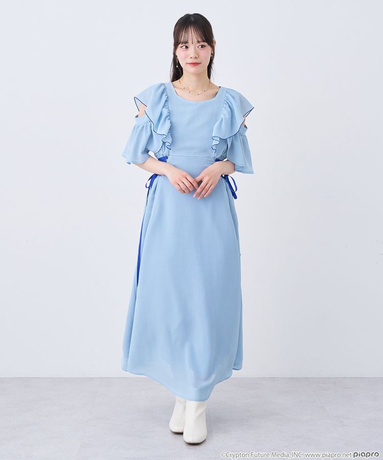 A model wearing a light blue women's one-piece dress with ruffled sleeves.