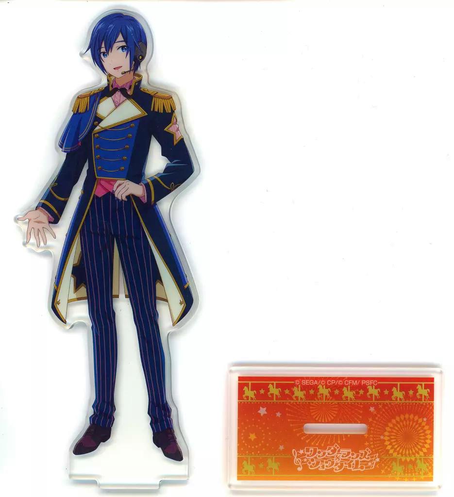 A full-body acrylic stand of Kaito displayed next to its rectangular orange base on a white background.