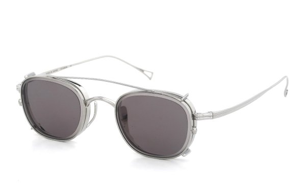 Three-quarter view of the KameManNen clip-on sunglasses (KMN-114, 46 size) with a silver frame and dark lenses on a white background.