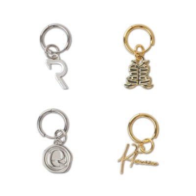 Four metal earring charms (two silver, two gold) arranged on a white background.