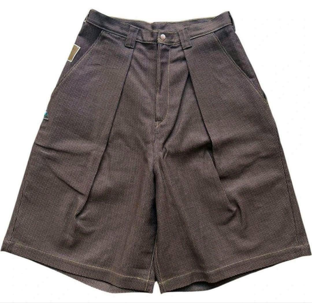 Front flat-lay photo of KAPITAL men's cotton shorts showing pleats and textured fabric on a white background.