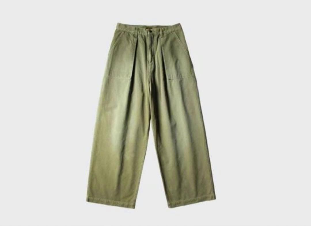 Green KAPITAL baggy fatigue pants laid flat on a white background.