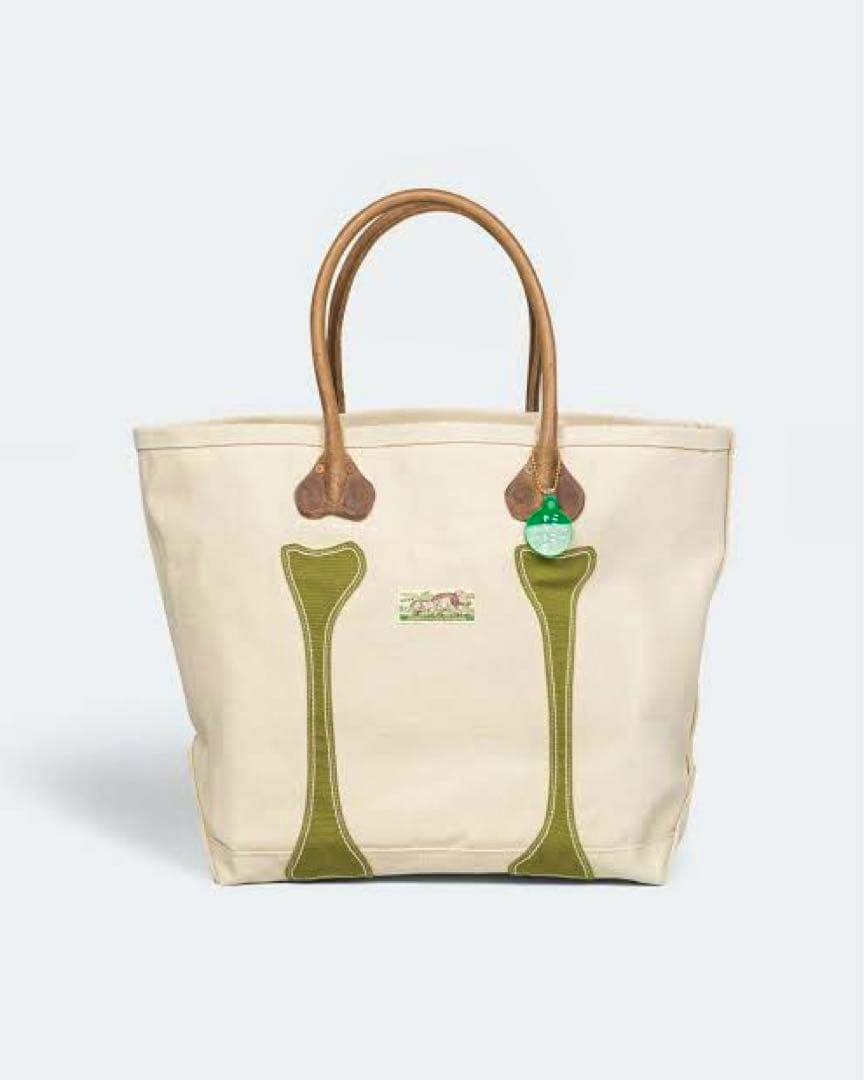 Front view of the Kapital コツコツトート M-size canvas tote bag in olive/khaki with olive green appliques and brown leather handles.
