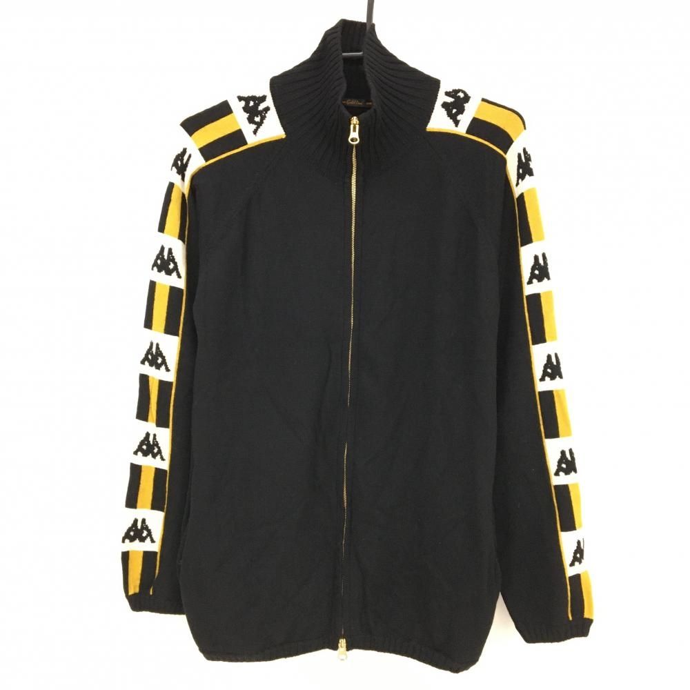 Front view of a black Kappa knit zip-up jacket with yellow-and-white striped sleeves showing repeated Kappa logos.