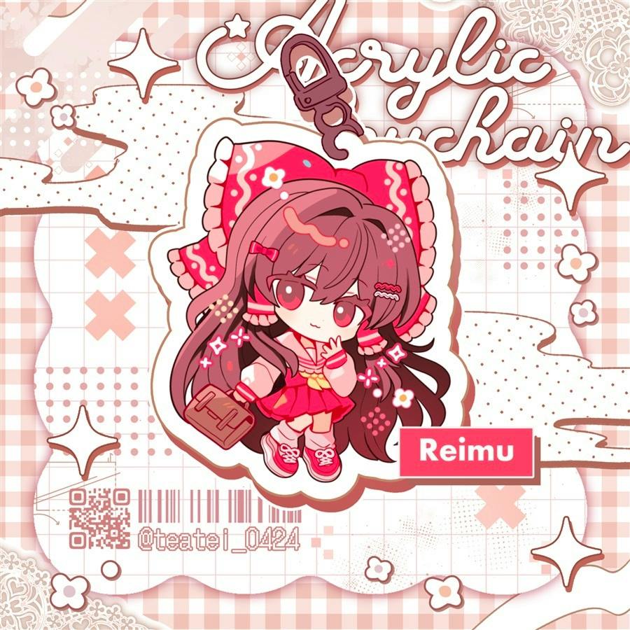 A chibi Reimu acrylic keychain illustration with clasp shown on a patterned promotional background.