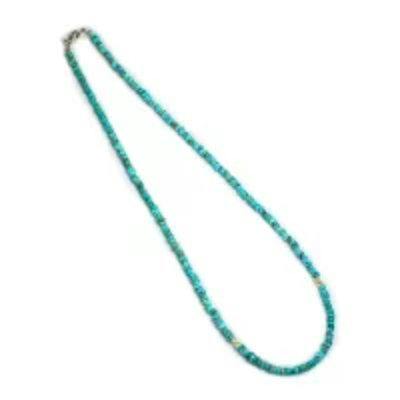 Turquoise chip-bead necklace laid flat on a white background.