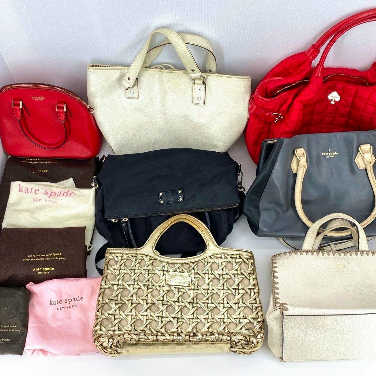 Multiple Kate Spade handbags and storage/dust bags arranged together on a white background.