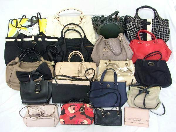 Multiple kate spade tote bags, handbags, and small wallets arranged on a white background.