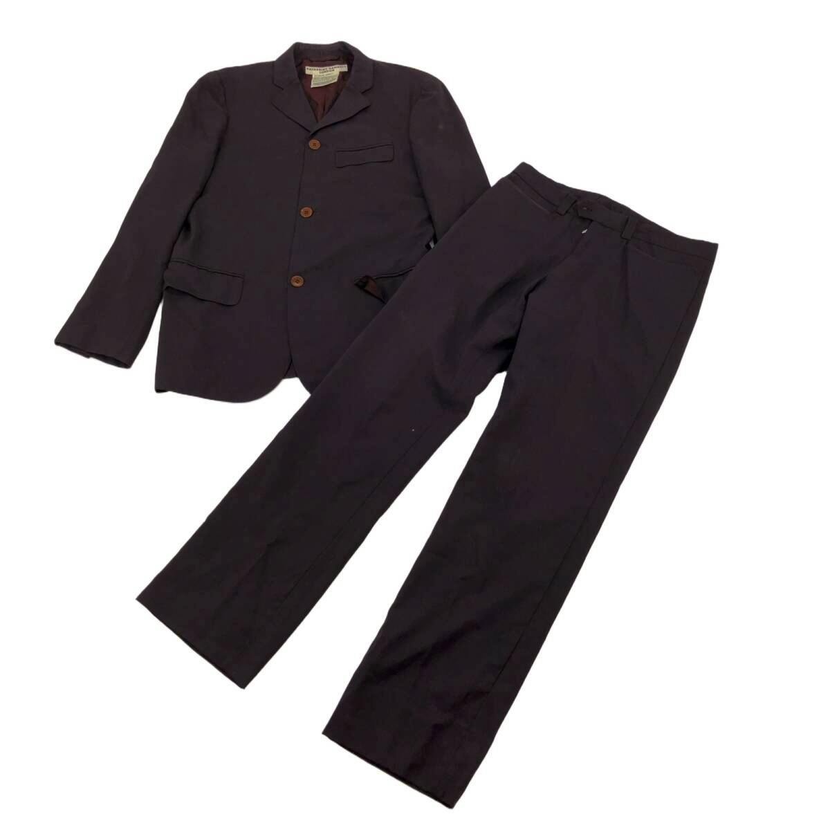 A dark navy men's wool suit jacket and matching trousers laid flat on a white background.