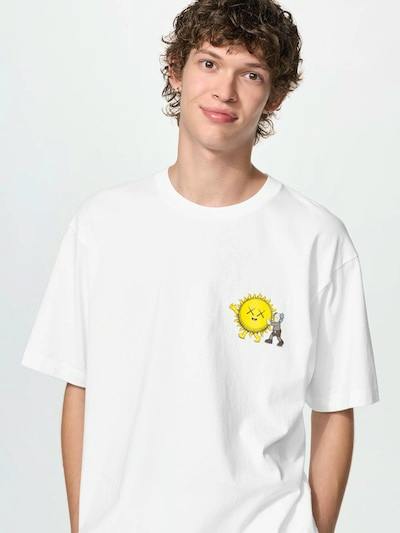 Model wearing a white men's cotton relaxed-fit T-shirt showing a small yellow sun graphic on the left chest.