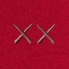 Close-up of red knit fabric with two embroidered ‘XX’ stitches for the neck warmer.