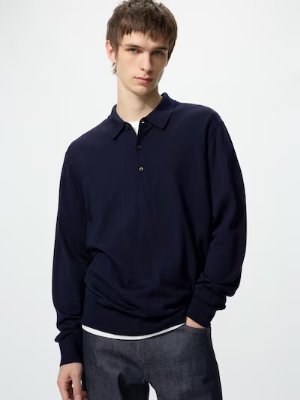 A male model wearing a navy wool sweater.