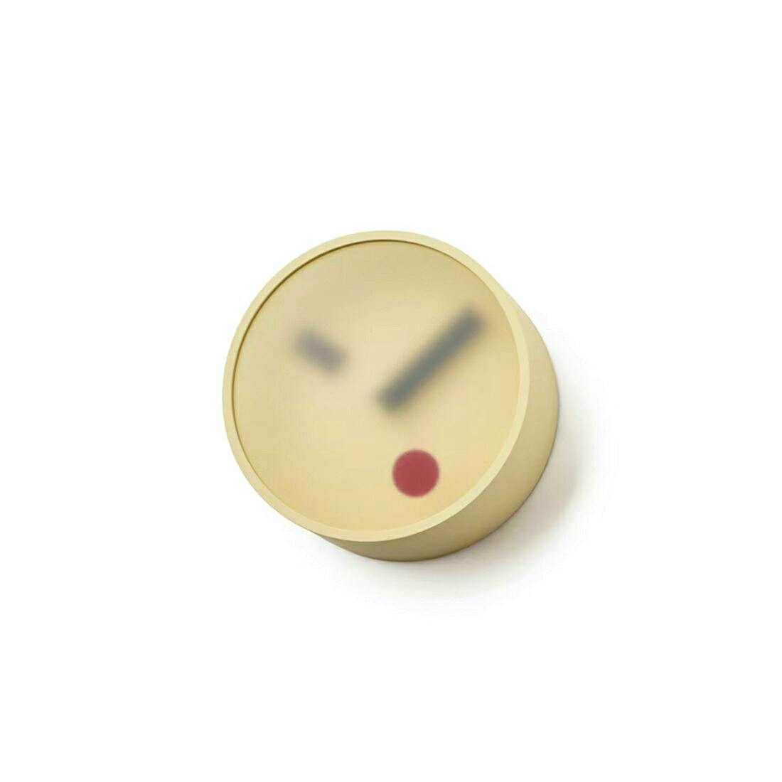Beige round wall clock with a minimalist face showing dark hands and a red dot on a white background.