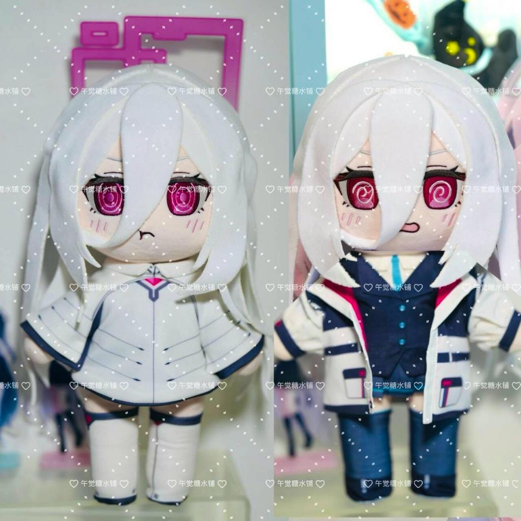 Two Kei-chan plush dolls photographed side-by-side wearing different costumes.